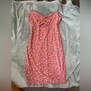 Purple dress with peek a boo hole. Yellow sunflowers